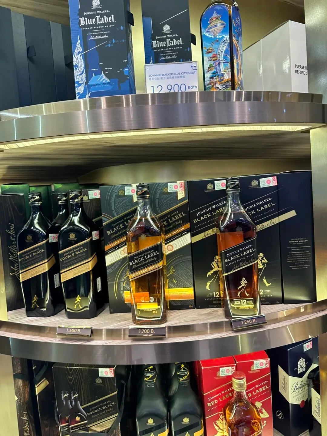 The Johnnie Walker shelf at Chiang Mai, priced in baht