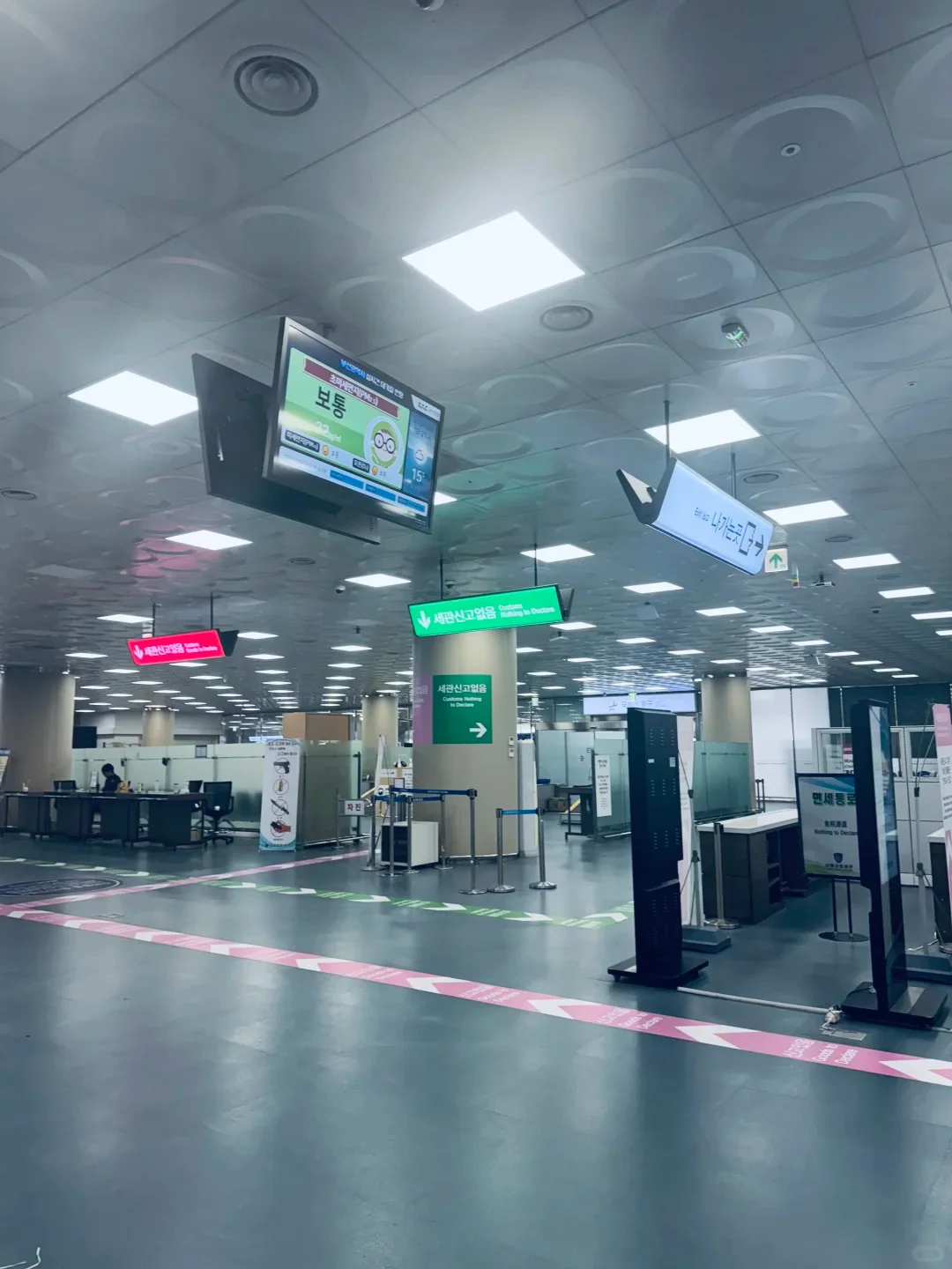 The customs and quarantine signs in the Gimhae Airport arrivals hall