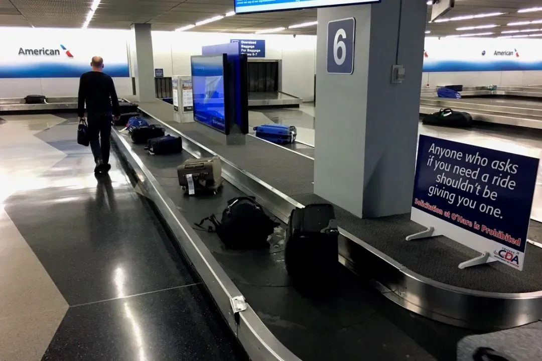The baggage claim area and flight information screens