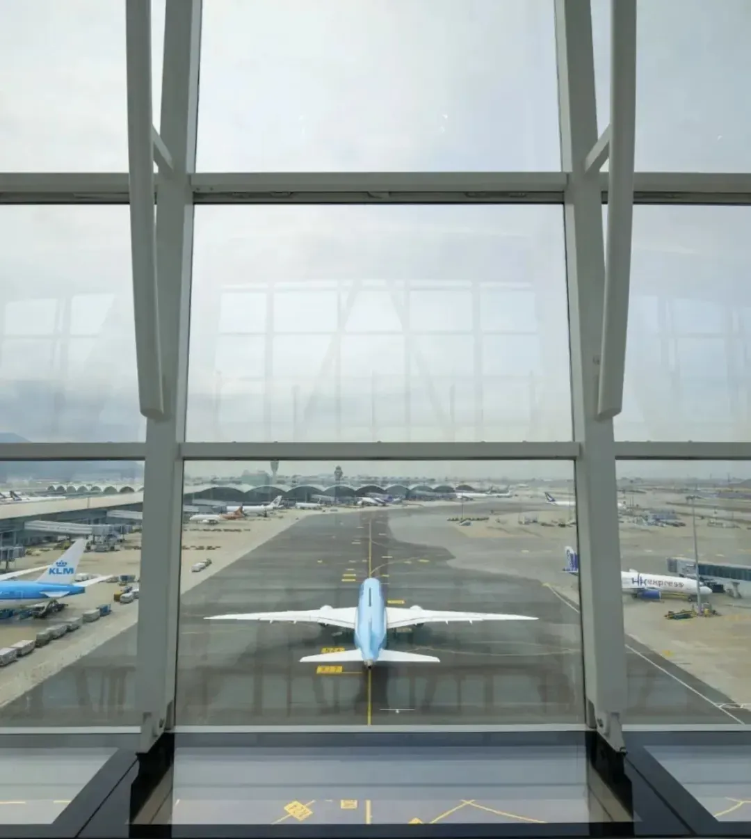 The Sky Bridge glass floor, with an aircraft on the apron below