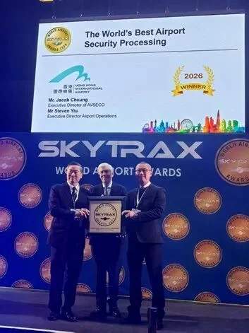 Hong Kong Airport Authority representatives on stage at the Skytrax World Airport Awards 2026, in front of the World's Best Airport Security screen