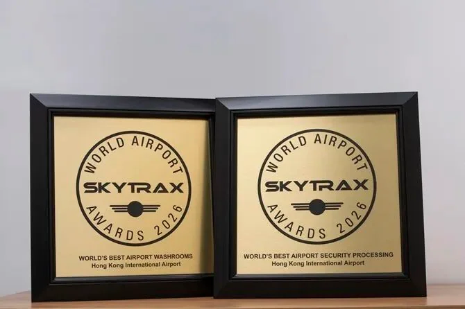 The two Skytrax 2026 certificates for security processing and washrooms