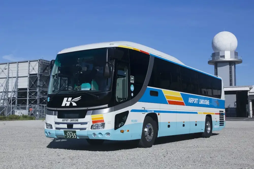 An airport limousine bus parked outside the terminal
