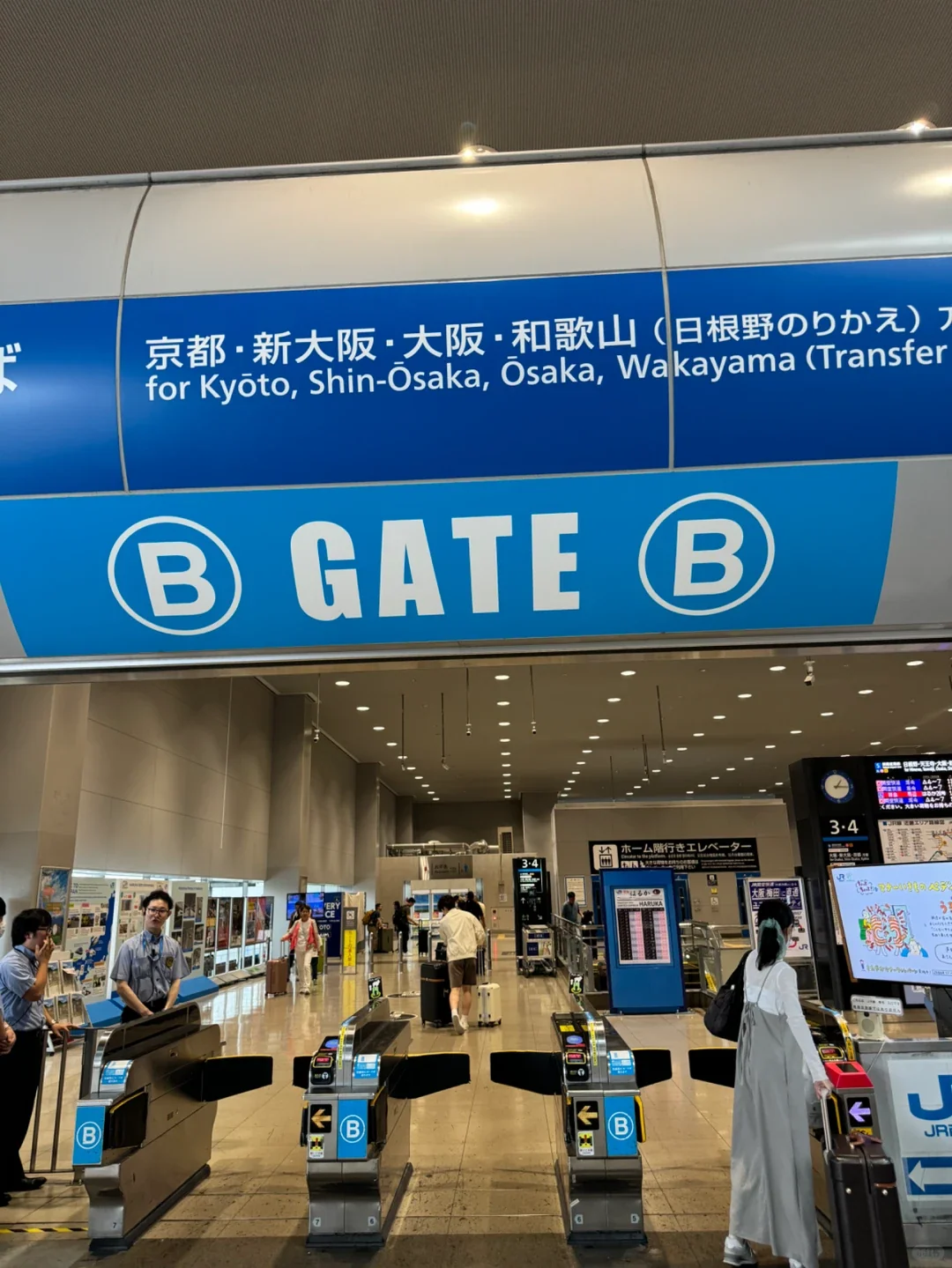 The blue gate at Kansai Airport Station, signed for Kyoto, Shin-Osaka, Osaka and Wakayama