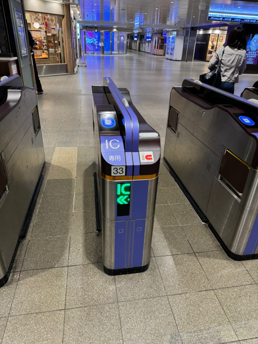 An IC-only ticket gate at a Hankyu station: tap in, tap out at the far end
