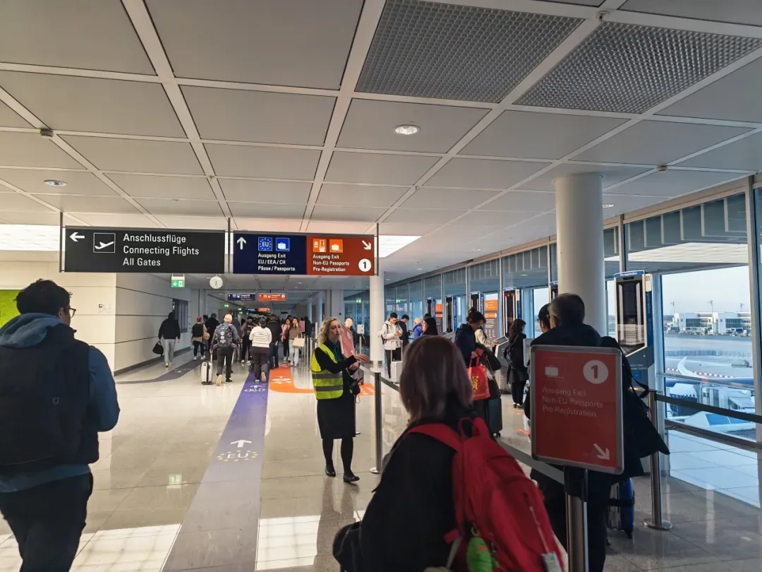 The blue and orange arrival channel signs