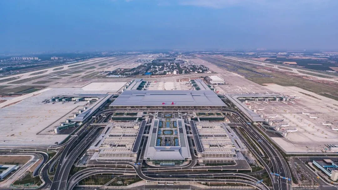 Aerial view of Terminal 5 and its integrated transport centre, with six piers fanning out from the main hall